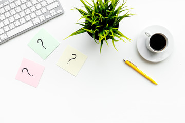 Poster - Question mark on sticky notes on office desk on white background top view copy space. FAQ concept. Working with clients. Troubles in work.