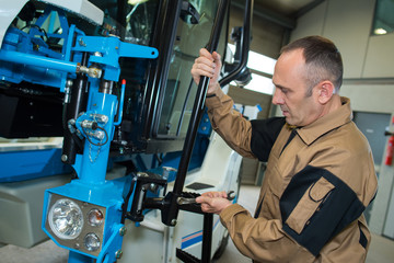 man fixing a machine