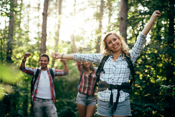 Wall Mural - couple trekking and hiking in forest