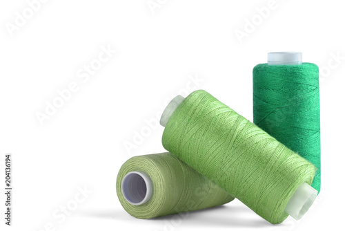 Fotografía sewing thread on white background for designers