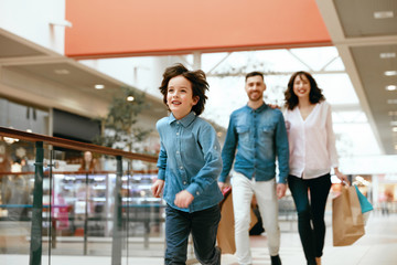 Family Shopping. Happy People In Mall