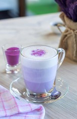 Wall Mural - Hot macchiato of purple potato on the table