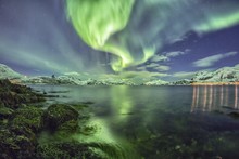 Northern Lights At A Fjord In Tromso, Norway, Europe