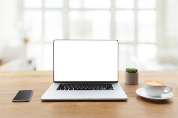 Aufkleber - laptop showing blank screen with cup of coffee and mobile phone on table