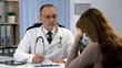 © motortion - Oncologist informing woman about incurable disease, patient feels depressed