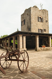 Fototapeta Desenie - Old iron plough with tower
