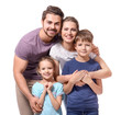 © Africa Studio - Portrait of couple with children on white background. Happy family