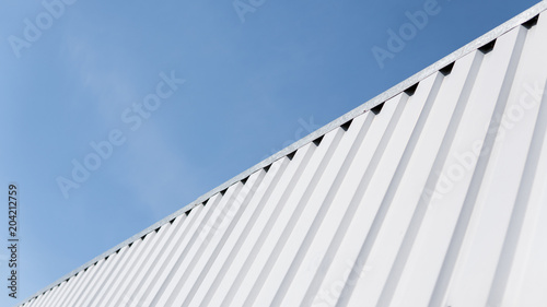 Fotomural Metal white sheet for industrial building and construction on blue sky background