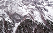 © Bakulov - Winter Alpine background. The mountainous terrain in the snow