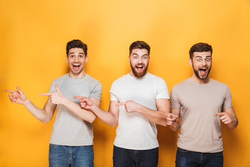 Sticker - Three young cheerful men pointing