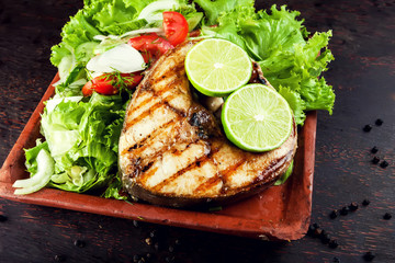 Wall Mural - Grilled Fish Fillet with Vegetables in the plate