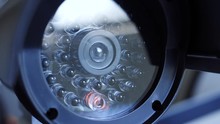 Closeup On A Surveillance CCTV Camera Lens With Infra Red Lights.