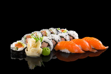 Sushi set isolated on the black background.