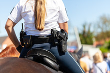 German Police Horsewoman Rides On A Police Horse
