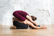 © uv_group - Couple practicing acro yoga poses in studio or gym. Men and woman, pair and acroyoga flexibility class workout on white brick wall background