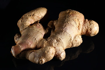 Wall Mural - Ginger root on a dark background