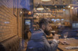 © Volodymyr - Businessman with long beard drink in cigar club. serious bar customer sit in cafe drinking ale. Date meeting of hipster awaiting in pub. Beer time. Bearded man rest in restaurant with beer glass.
