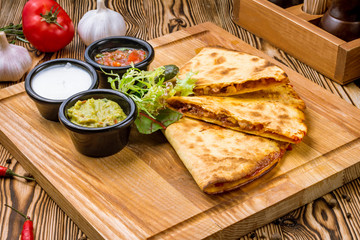 Wall Mural - Quesadilla with chicken and sauces