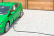 Modernes Elektroauto in grün tankt zu Hause Strom Luftperspektive