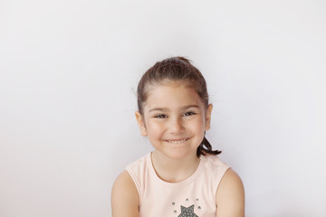 Portrait of a happy smiling child girl.