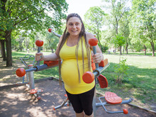 Pregnant Woman Fitness Outdoors Park