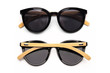 Stylish black sunglasses with wooden rim isolated on white background