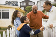 © Erickson Stock - Father, son and daughter visiting Grandfather