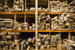 © Mint Images - Large selection of wooden planks stacked on shelves in a warehouse.