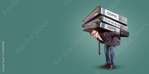 Man carrying an enormous stack of GDPR files