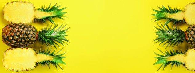Wall Mural - pattern with bright pineapples on blue background. top view. copy space. minimal style. pop art desi