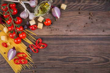 Wall Mural - Ingredients for cooking spaghetti - raw pasta, tomato, olive oil, spices, herbs