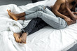 cropped image of african american couple hugging in bedroom