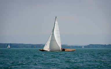  Classic sailing boats racing at a regatta at lake constance