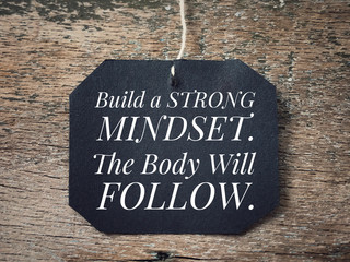 Wall Mural - Motivational and inspirational quote - Build a strong mindset. The body will follow. With vintage styled background.