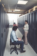 © fotoinfot - Man and woman working on servers at data center
