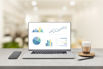 Poster - Laptop on wooden table showing charts and graph