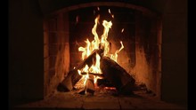 Burning Fire In The Fireplace. Slow Motion. A Looping Clip Of A Fireplace With Medium Size Flames