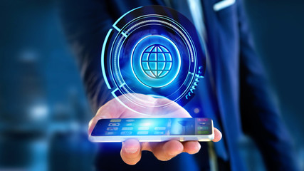 Poster - Businessman using a smartphone with a Shinny technologic globe button - 3d render