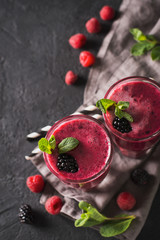 Wall Mural - Blackberry and raspberry smoothies in glass with mint leaf and raw beeries