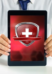 Poster - Health shield icon and hands holding tablet
