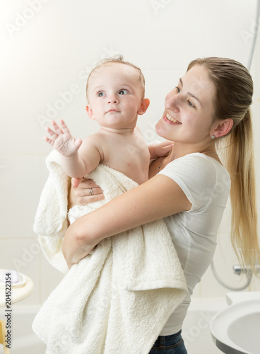 baby holding towel