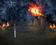 A Burning Demon Eye Flying Over A Castle Ruin In A Stormy Night, A Knight Sword Is Sticking To The Ground. Shot Was Taken In Vintebbio, An Abandoned Medieval Ruin, It Is Accessible Through A Footpath