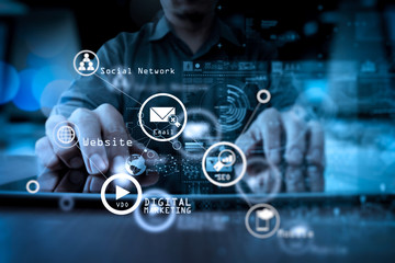 Poster - businessman hand working with modern technology and digital layer effect as business strategy concept