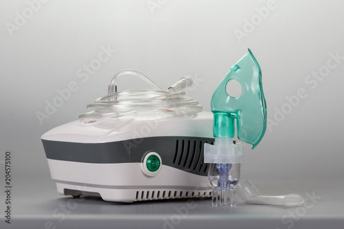 Fotografia Compressor inhaler for physiotherapy, on gray