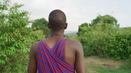 rear view of a maasai man walking