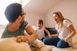 © Nebojsa - Cute happy child with parents having pillow fight in bed at home
