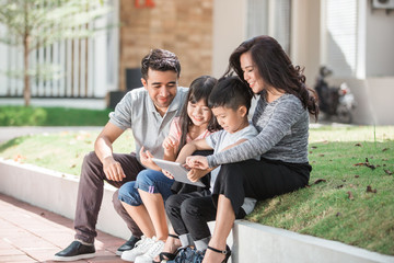 modern young family using tablet