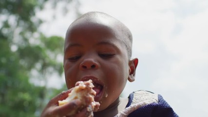 close up of an african child eating