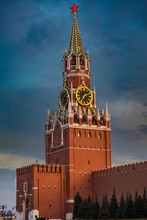 Spasskaya Tower On Red Square, Moscow, Russia At Sunset With Glowing Red Star On The Top