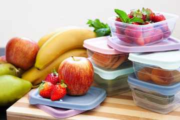 Filled plastic containers to save food and fruits fresh